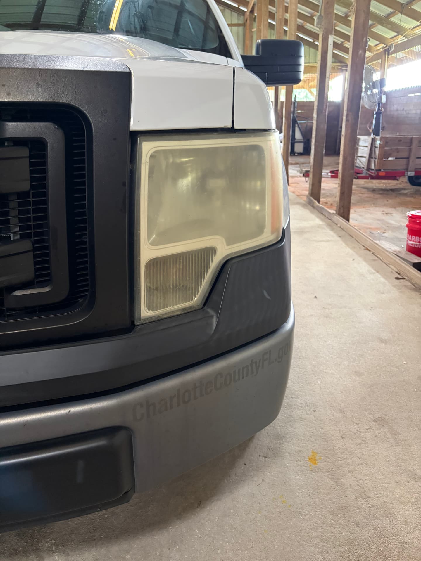Yellowed oxidized headlight before restoration