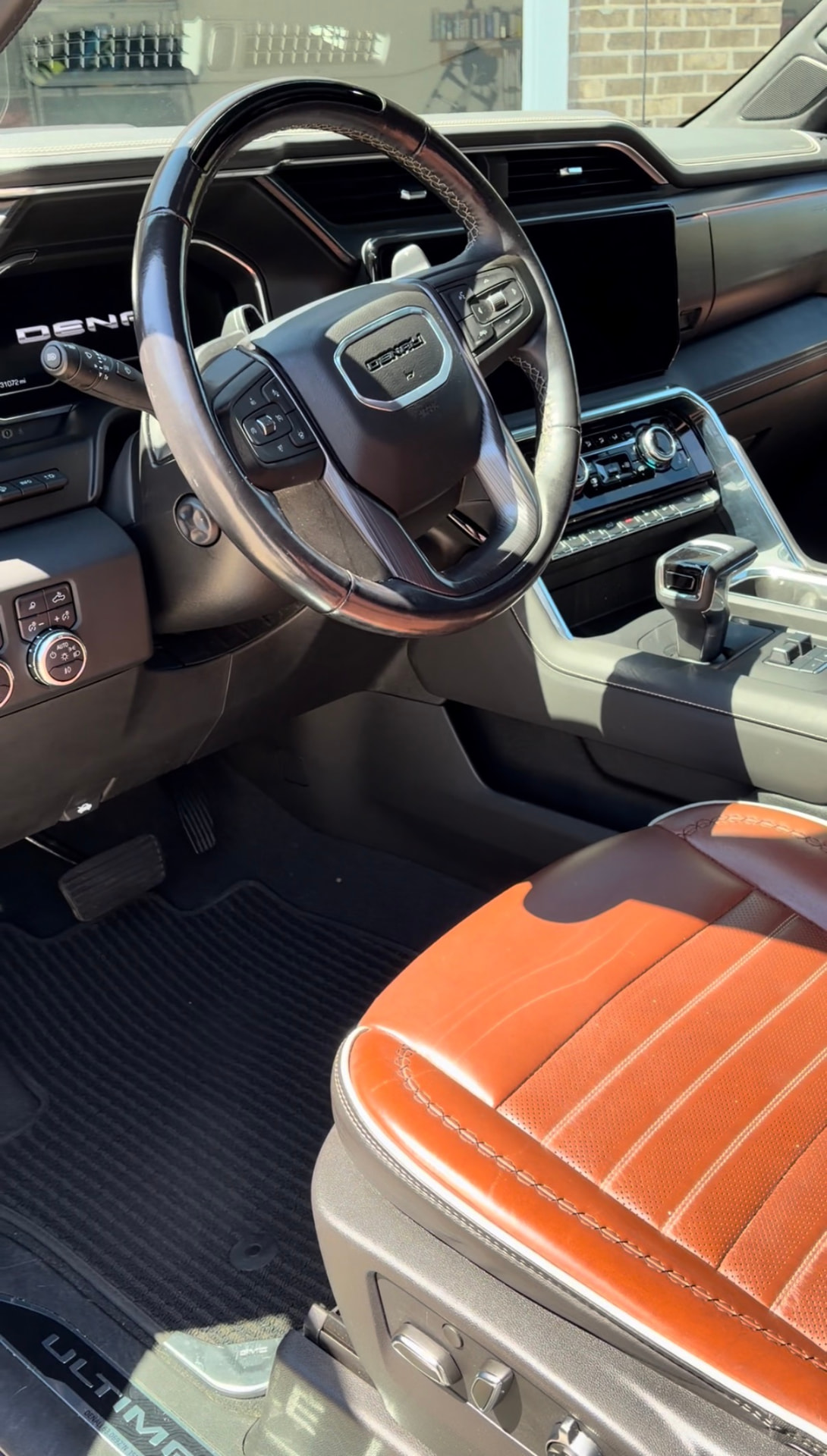Freshly detailed GMC Denali interior with orange leather seats